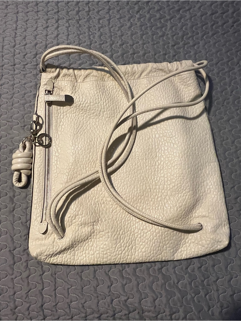 henri bendel Cream Pebbled Leather Drawstring Backpack